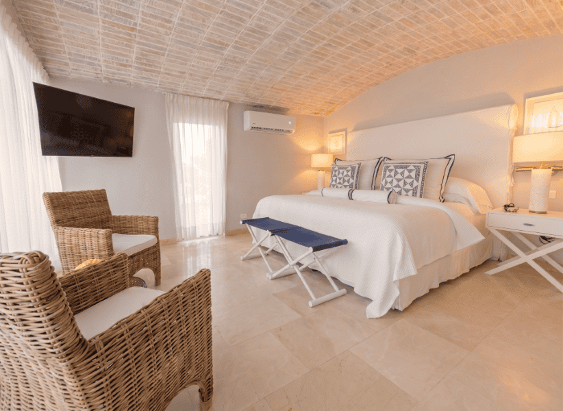 Suite en Casa La Merced en Mustique, alojamiento de lujo con vistas y comodidad.