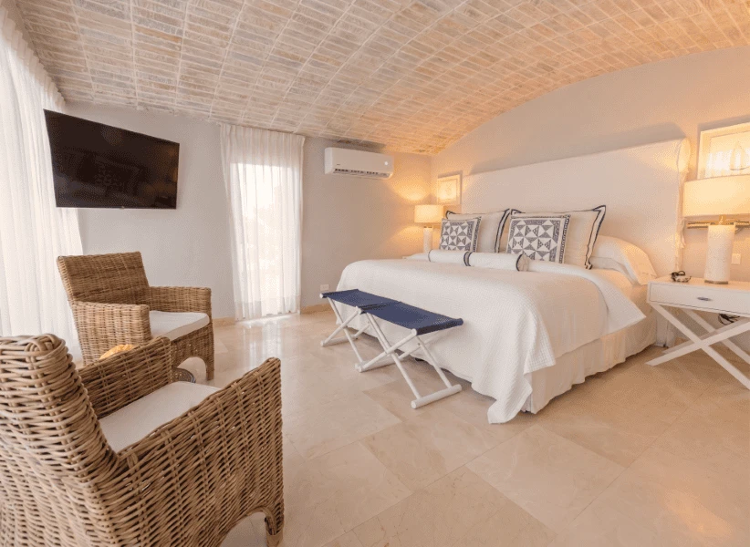 Suite en Casa La Merced en Mustique, alojamiento de lujo con vistas y comodidad.